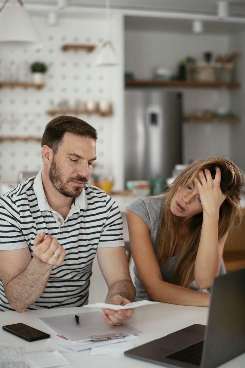 Husband and wife preparing bills to pay. Young couple having financial problems